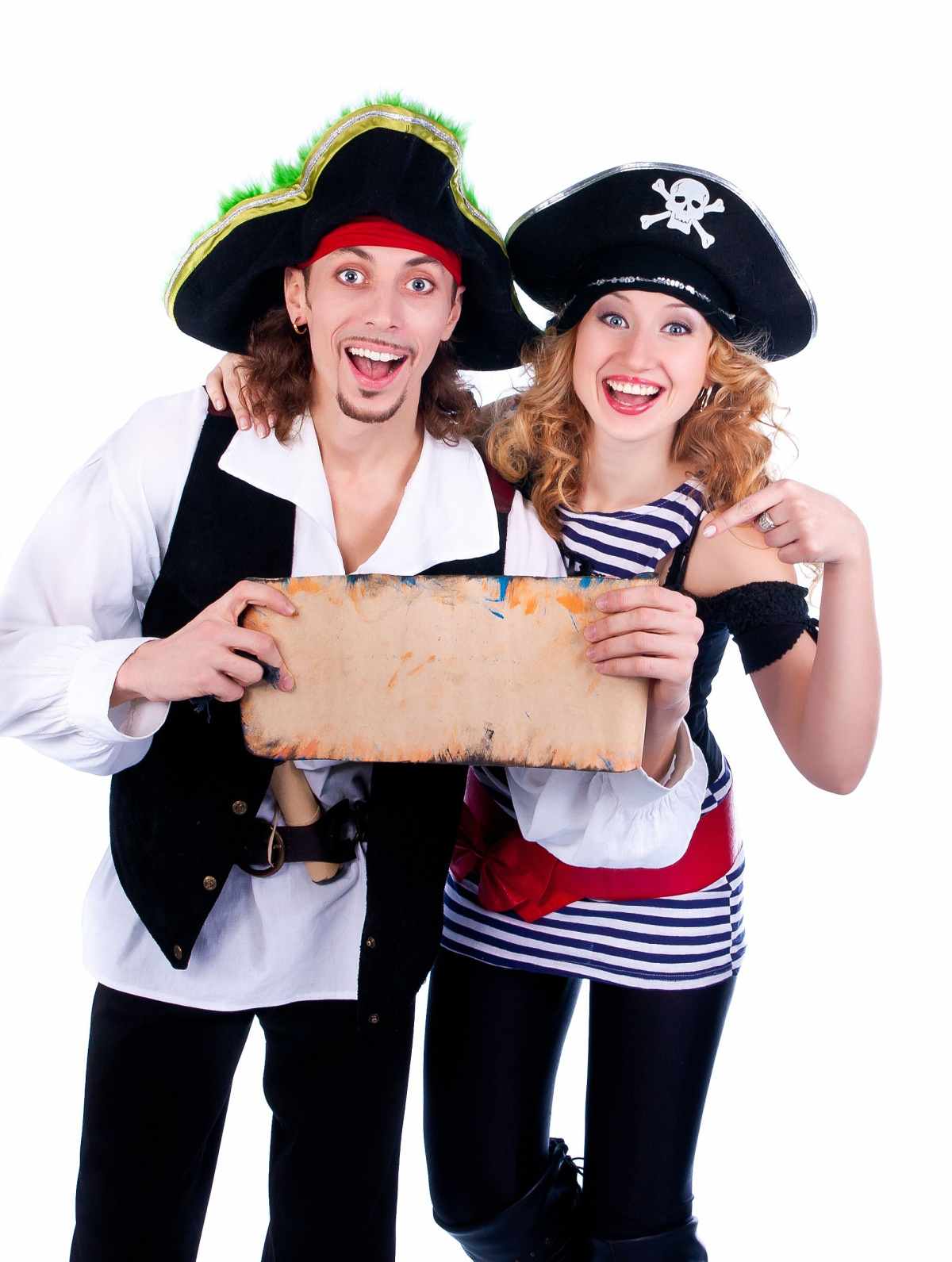 A man and woman wearing DIY pirate costumes, holding a blank scroll of paper.