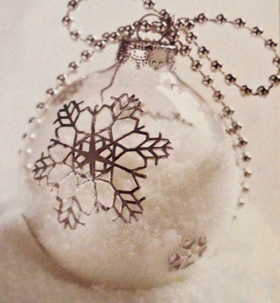 DIY snow filled ornament with snowflake decal.