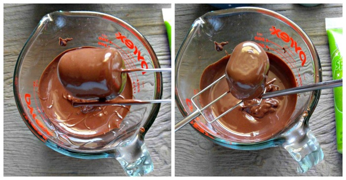 Dipping marshmallows into melted chocolate