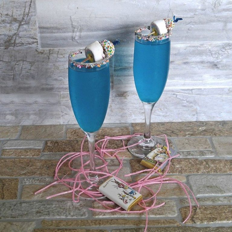 Two blue cocktails called Easter midnight kiss cocktails.