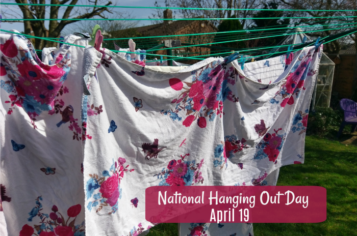 A photo of flowered sheets hanging on a green clothesline with a text overlay reading "April 19 is National Hanging Out Day".