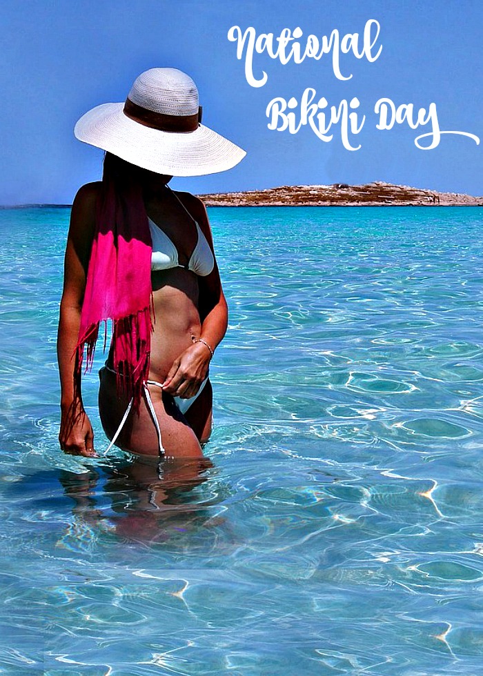 Girl standing in the water in a bikini for National Bikini Day