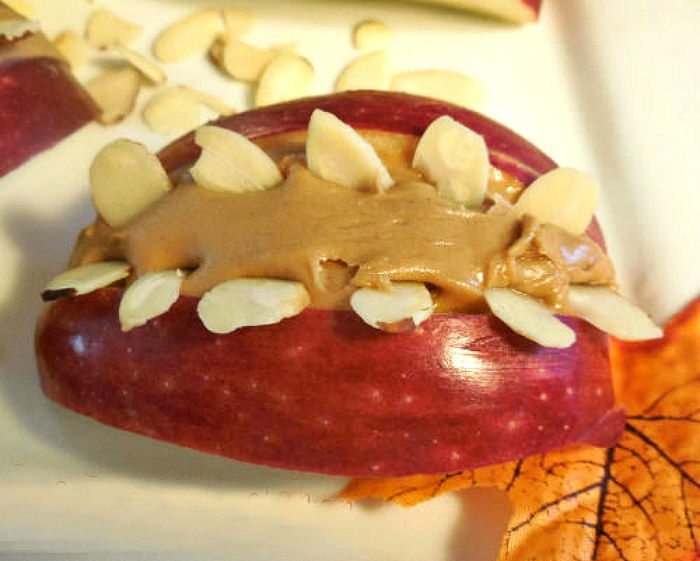 Halloween mouth apple with peanut butter and almonds.