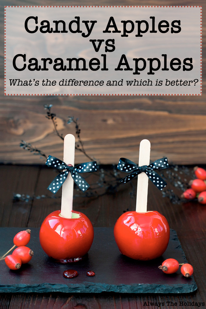 Two candy apples with black polkadot bows on them, on a slate serving board with a text overlay reading "candy apples vs caramel apples what's the difference and which is better?".
