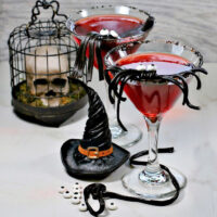 Vampire cranberry cocktail with licorice spider garnish