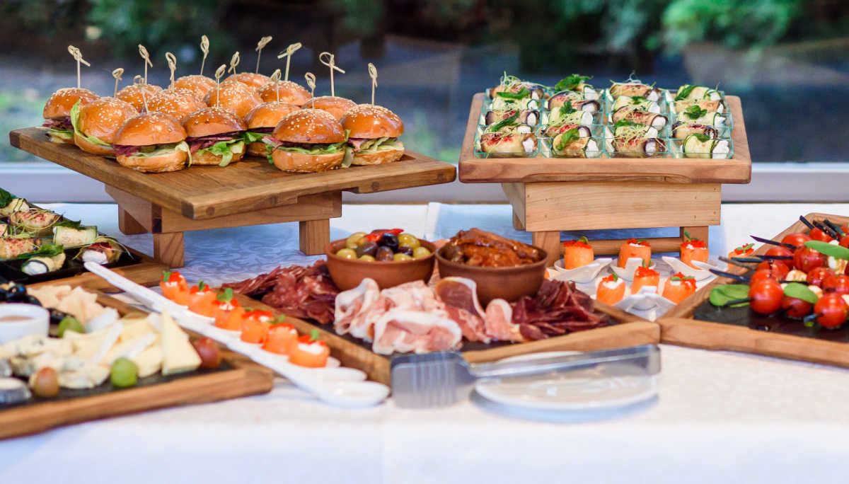 Trays of party food on a table.