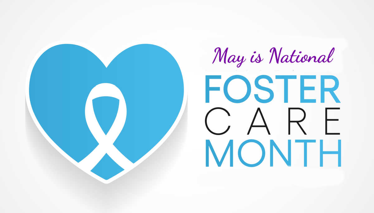 White ribbon on a blue heart with words May is National Foster Care Month.