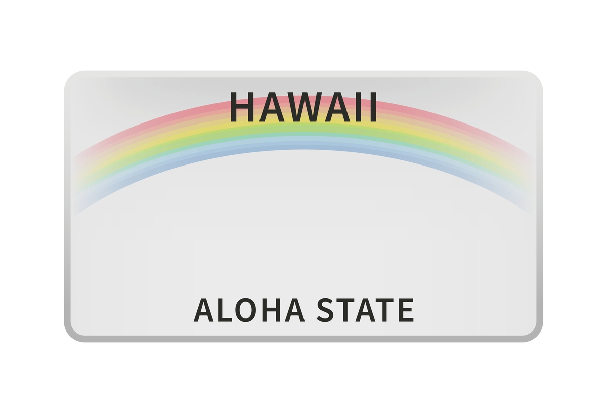 A Hawaii license plate with the words "Aloha State" at the bottom, and the image of a rainbow across the center of the license plate.
