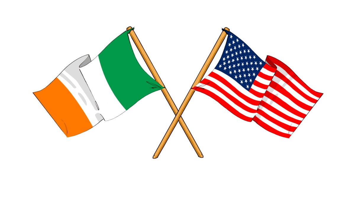 A tricolor flag of Ireland and a flag of the United States of America crossed at their flagstaffs, to represent the combination of the two places, celebrating Irish Americans.