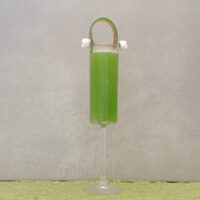 A St. Patrick's Day mimosa recipe with mimosa garnish that looks like a rainbow and two clouds.