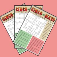 A light red background with three Cinco de Mayo crosswords fanned out across it.