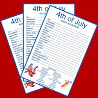 Three free printable 4th of July word scrambles fanned out on a red background.